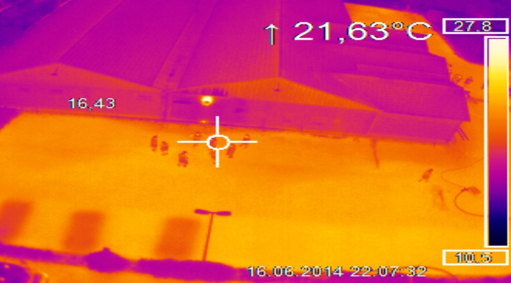 Thermal image of a building and forecourt with temperature reading above 21 degrees Celsius.